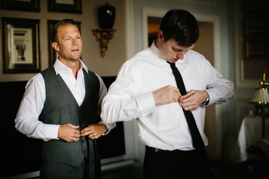 groom getting dressed in downtown florence