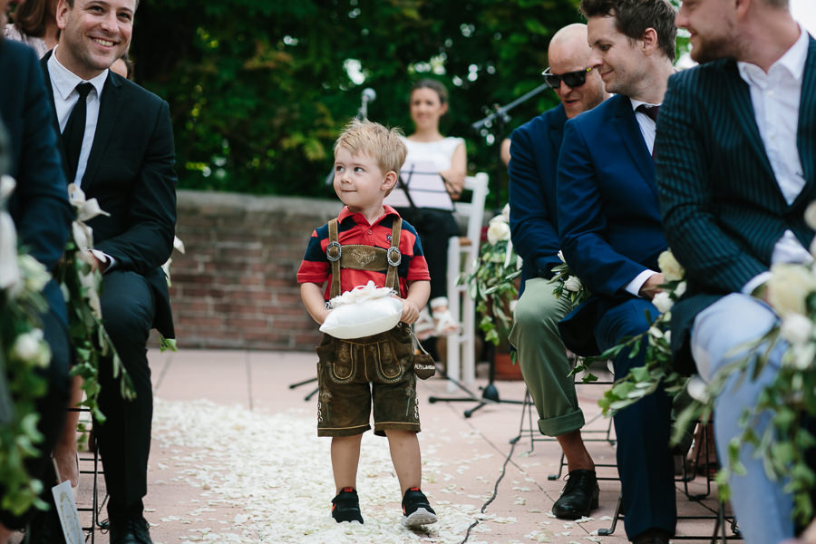 little boy bringing the rings