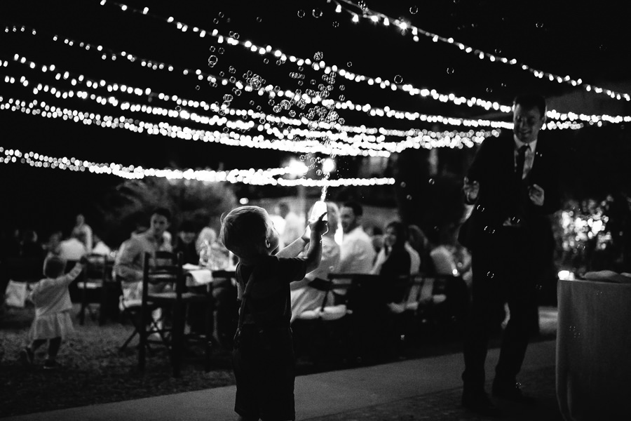 little boy playing during wedding reception in piemont