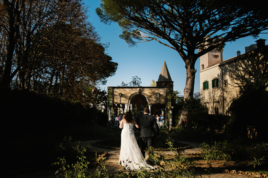 Bride and her brother walking down the aisle