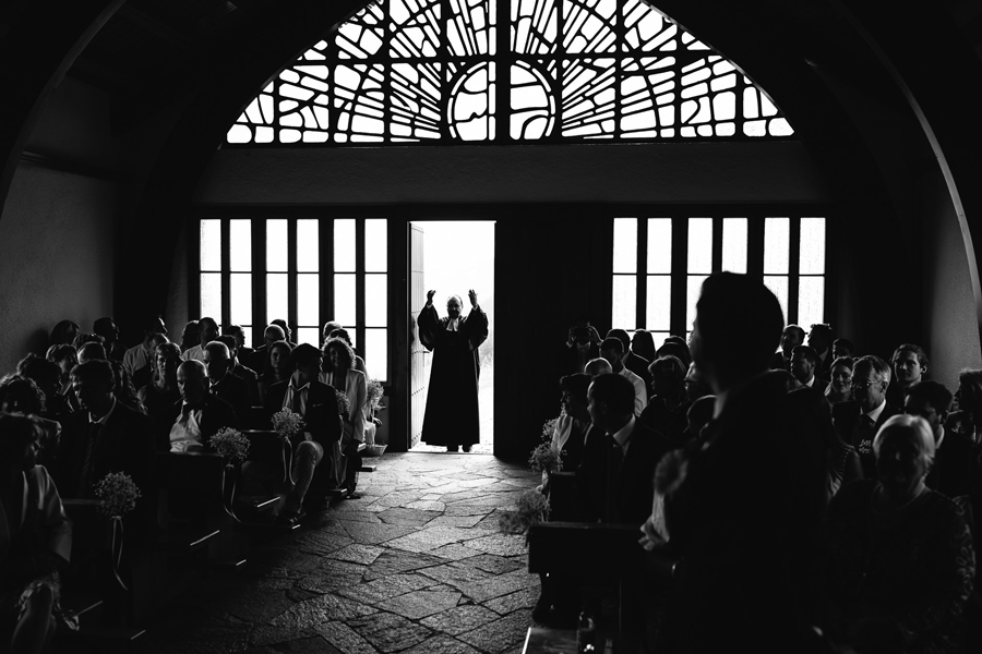 Groom and his mother entering wedding ceremony venue