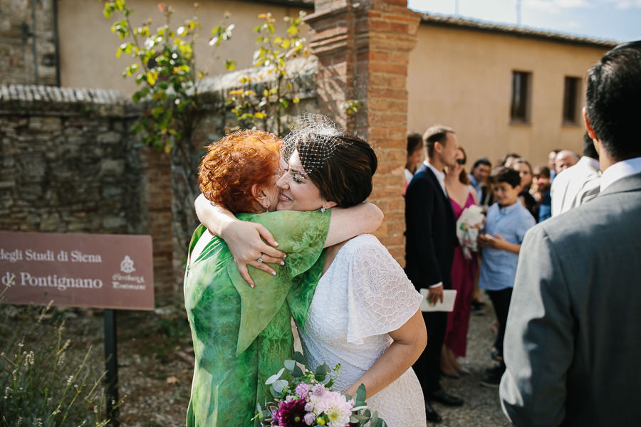 Wedding couple leaving church in Tuscany