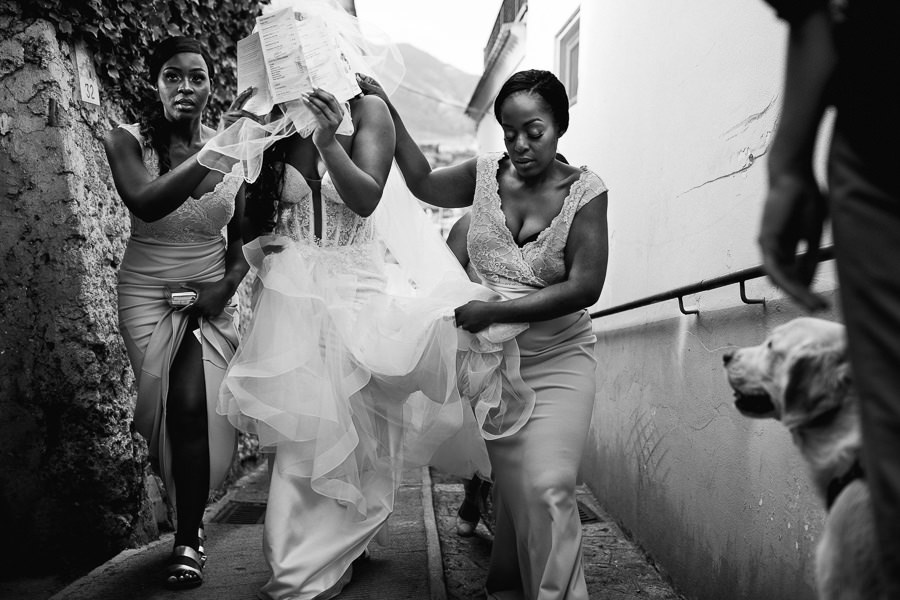 Bride and Bridesmaids walking to wedding cermony venue in ravell