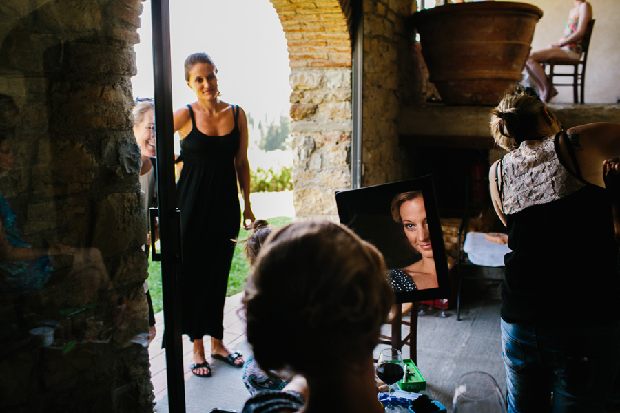 Tuscany wedding bride getting ready looking in the mirror