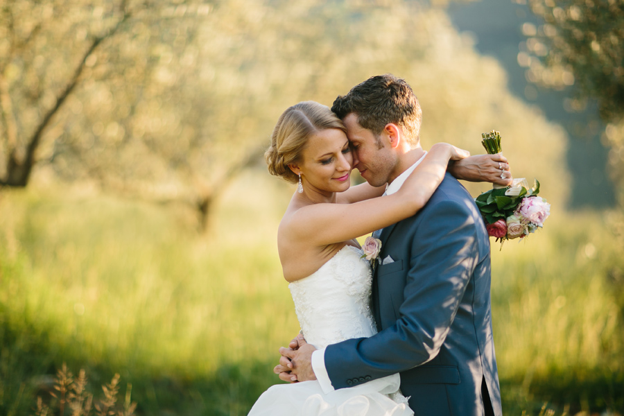 Wedding portrait of bride and groom in the vineyards of castello