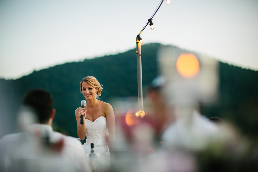 Bride having her first speech during wedding reception in tuscan