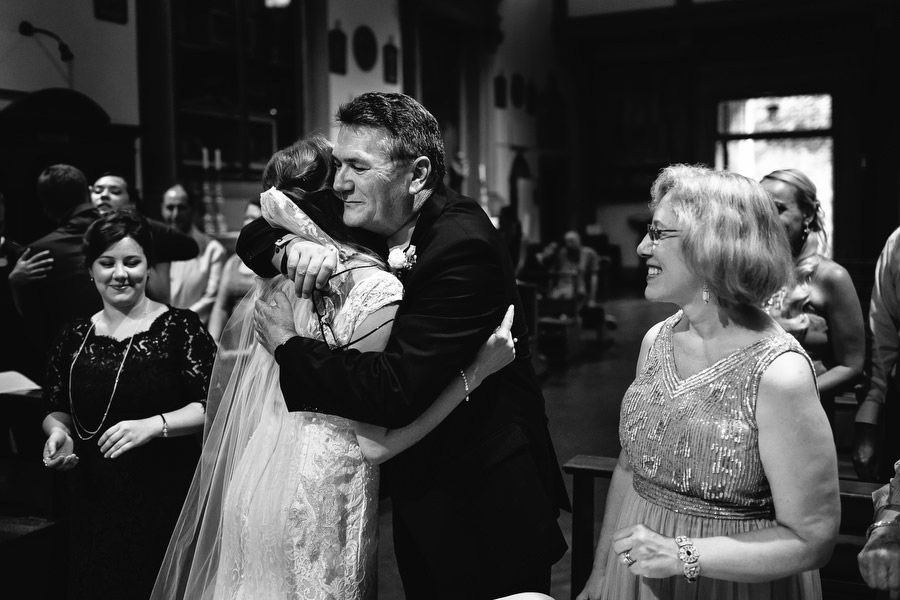 bride hugging her father during wedding ceremony in florence