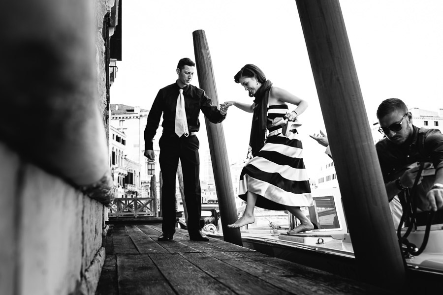 Wedding guest Gets off the boat in Venice