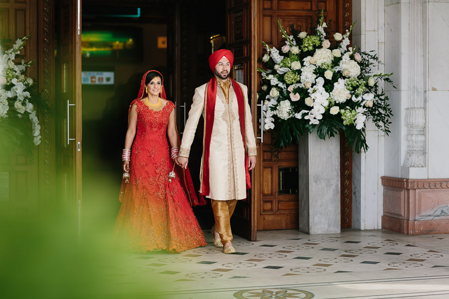 bride and groom walk out Gravesend Gurdwara