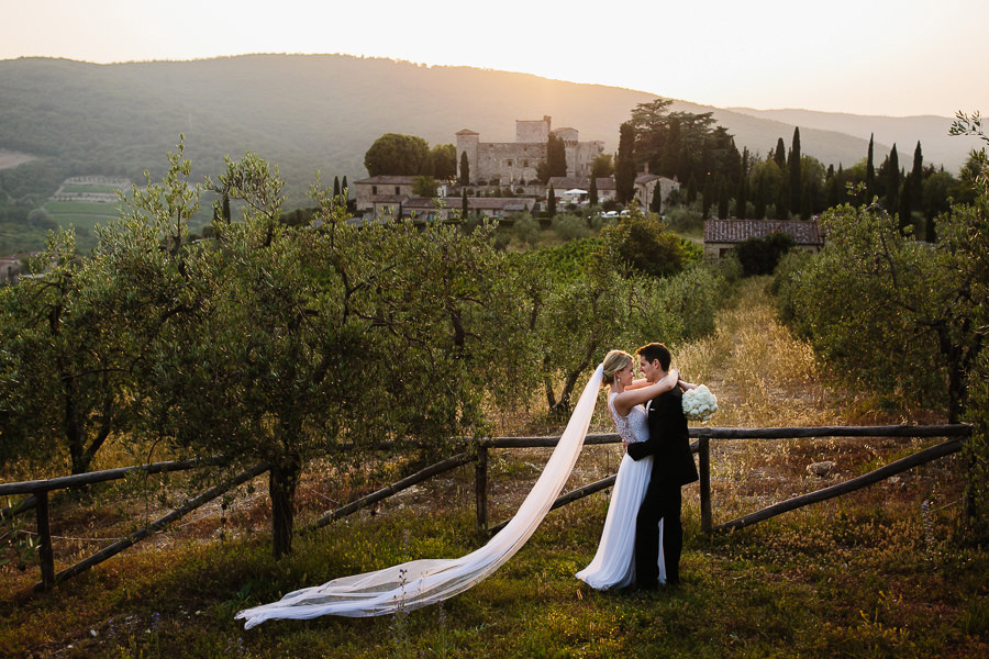 castello di meleto wedding bride and groom kiss