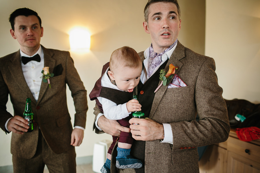 baby with a beer at tuscany wedding