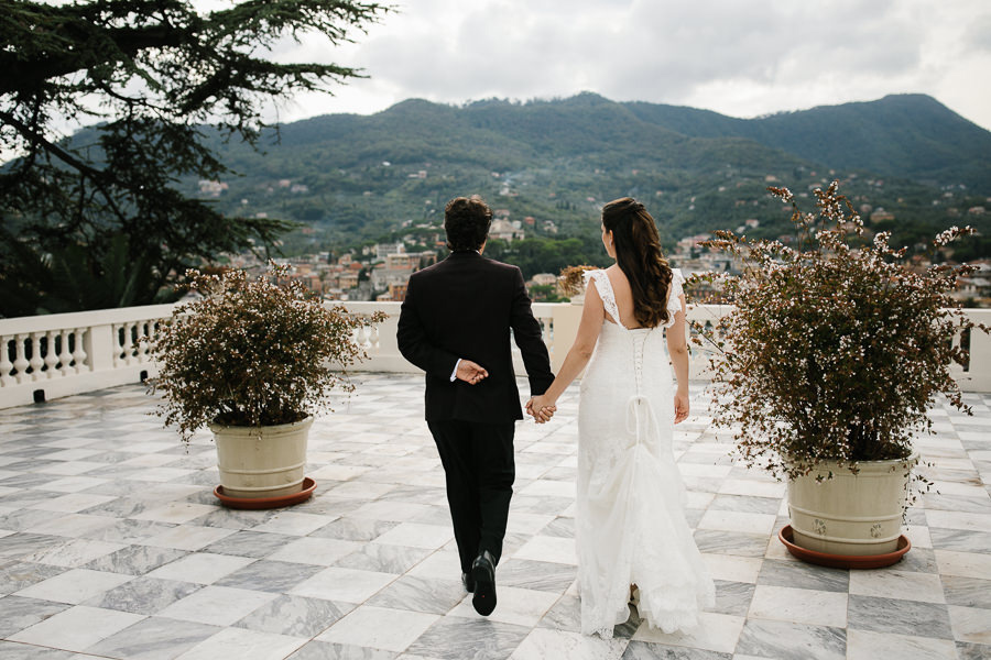 bride and groom walking hand in hand