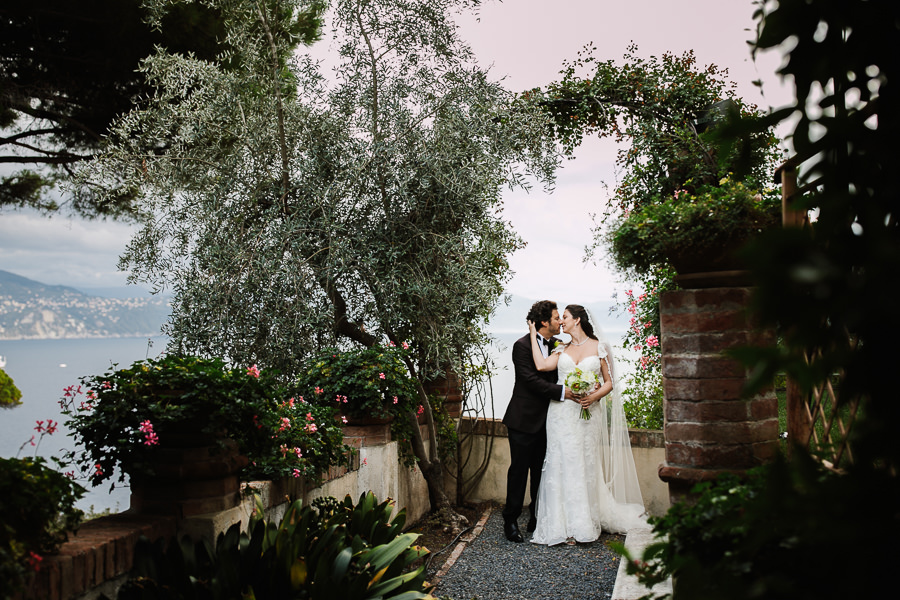 bride and groom portrait with mediterranean sea in the background