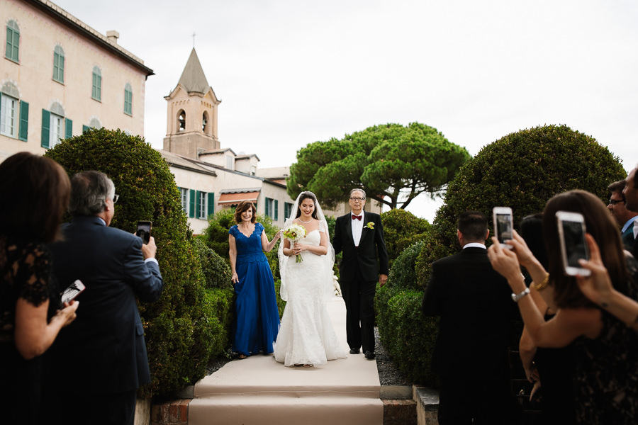 brind and her parents walking down the aisle portofino wedding