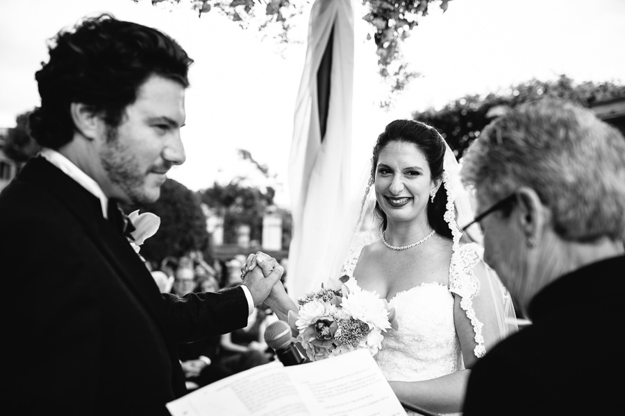 bride and groom holding hands