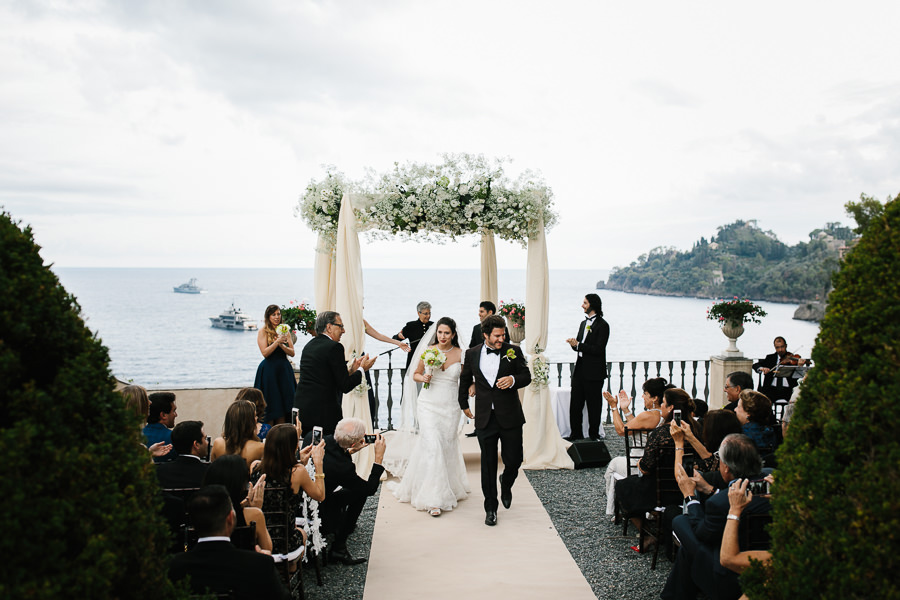 bride and groom walking together after wedding ceremony