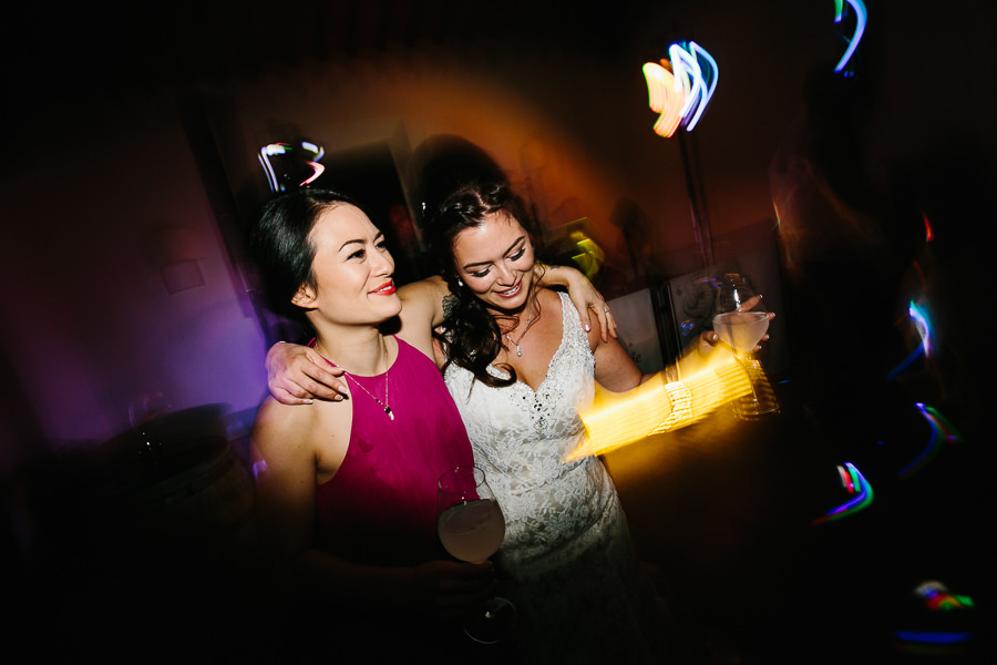 bride and her sister dancing