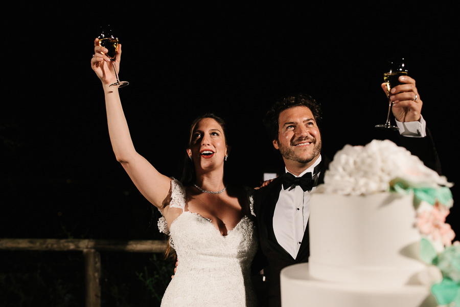 bride and groom cutting the cake