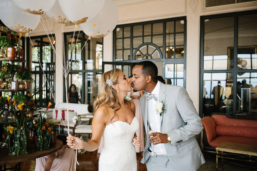 bride and groom kissing at timeo hotel