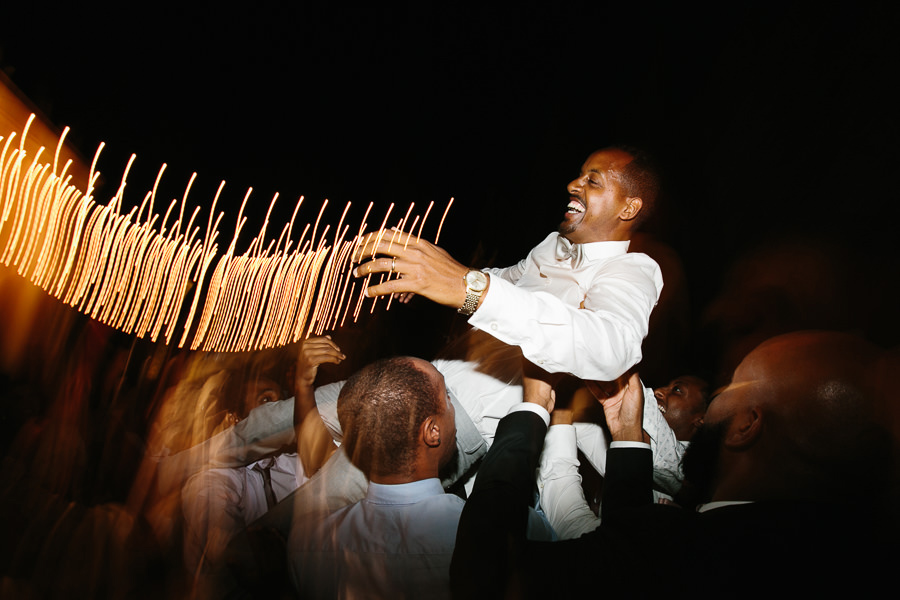 flying groom at wedding reception