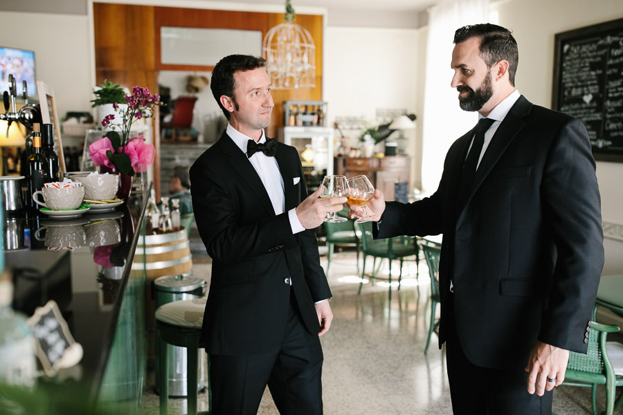 Groom having a drink at his Wedding on Lake Como