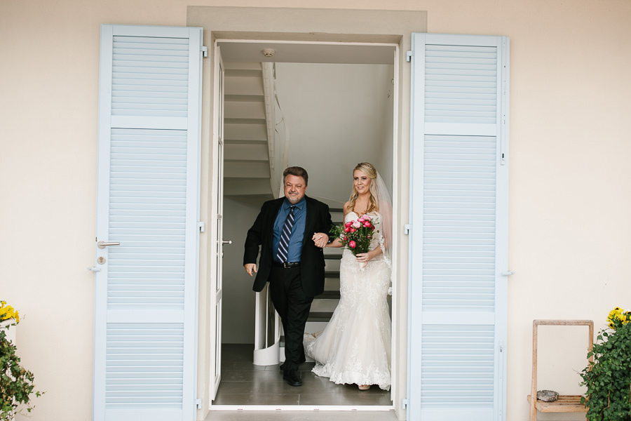 bride and her father walking down the aisle on lake como wedding