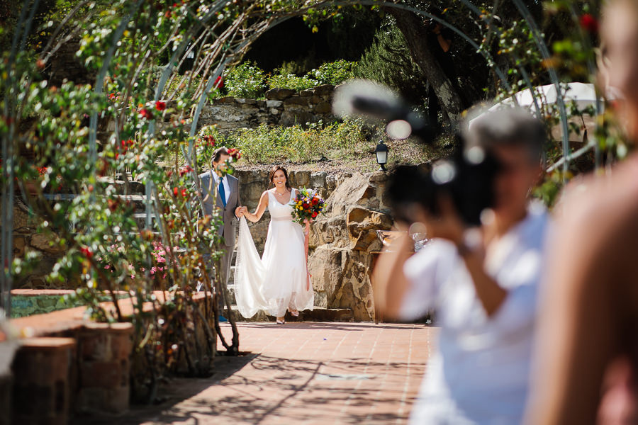 bride walking down the aisle in tuscany