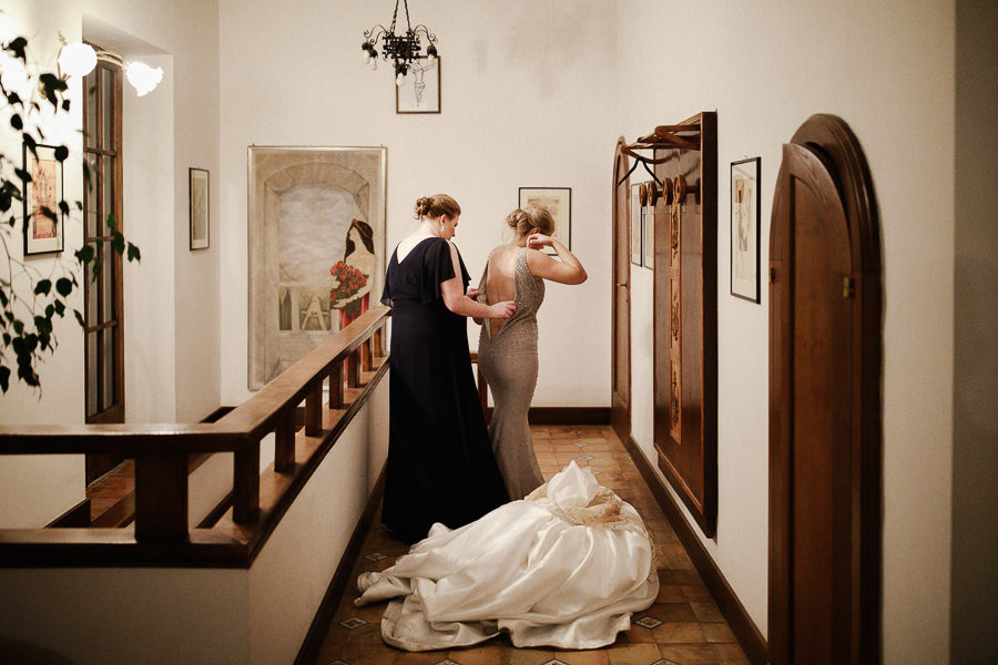 Bride walking up the stairs and changes dress at Villa Eva weddi