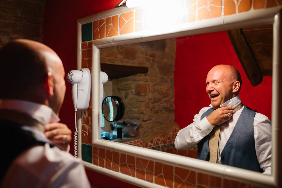 Bride and Groom getting ready for wedding in Tuscany