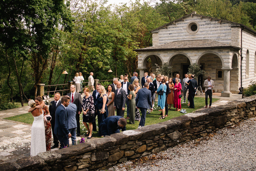 Bride and groom leaving wedding church in Tuscany