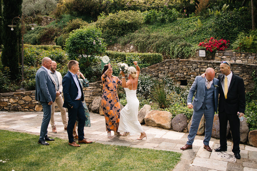 Hugs and kisses at wedding at Antico Borgo Valle Di Badia