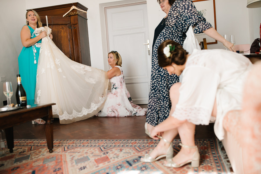 bride getting her makeup done for wedding