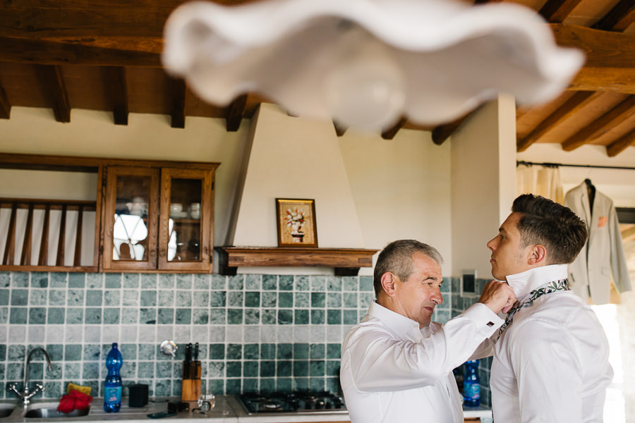 groom put on hi bow tie