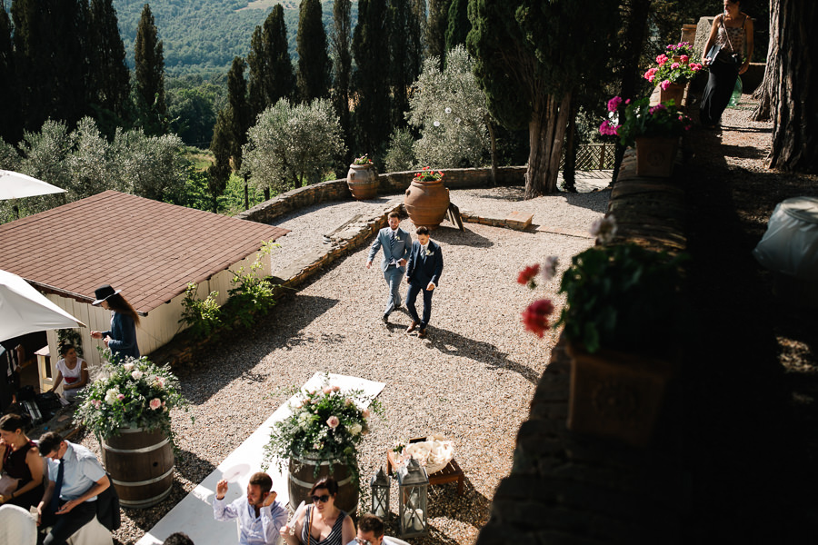 bride putting on her dress for wedding at tenuta mocajo