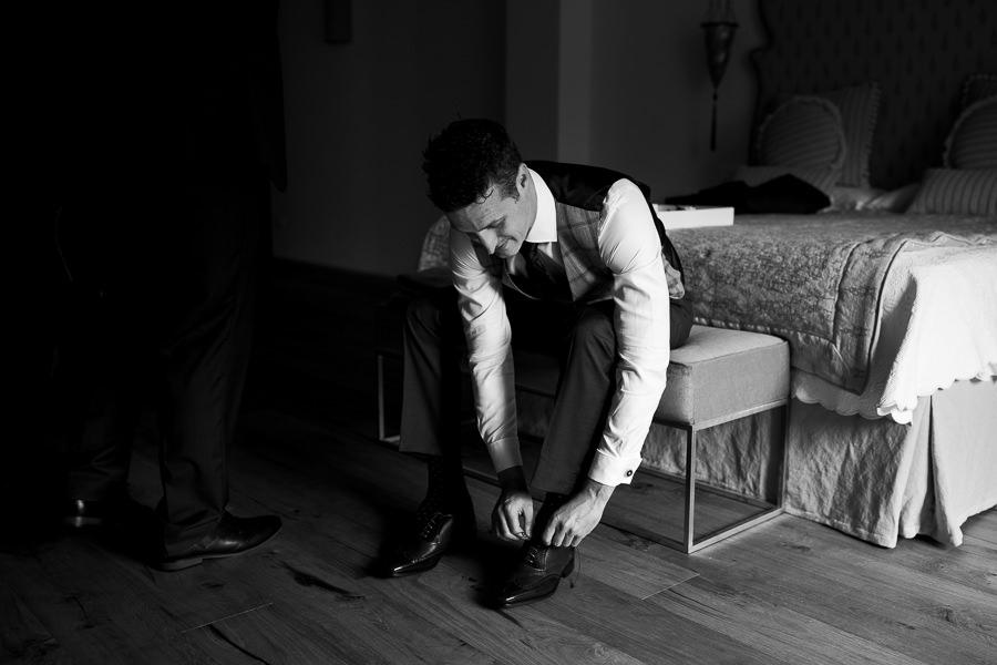 Groom and his best mean getting ready for wedding in tuscany