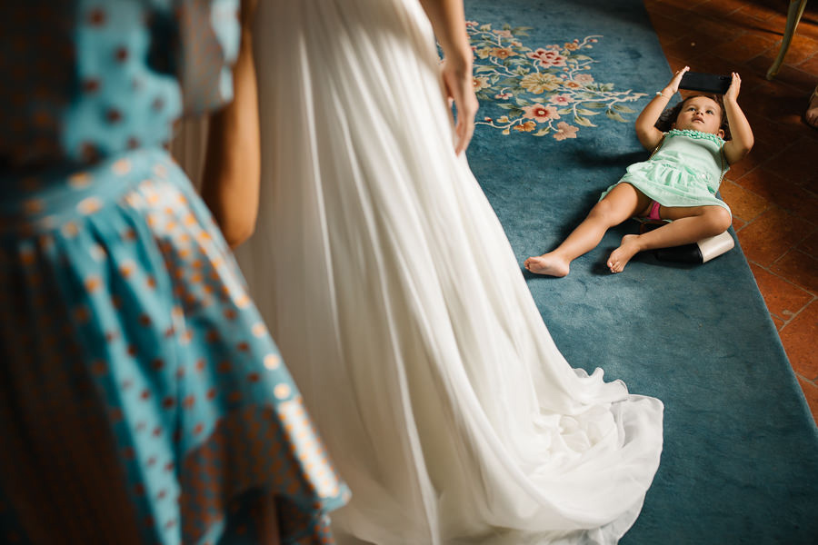 Bride putting on her dress at Castello di Meleto