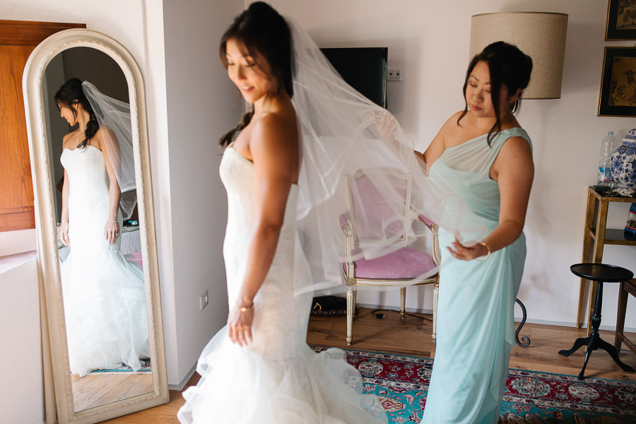 bride with her dress and veil at castello di meleto