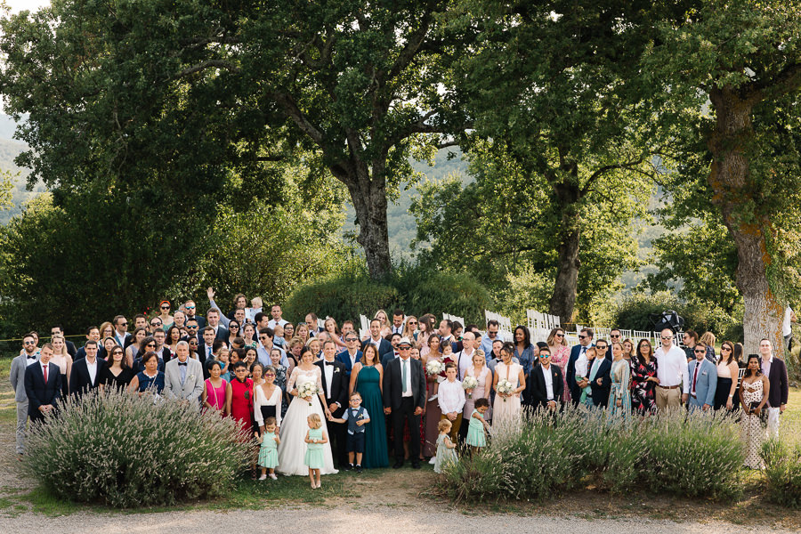 bride and groom walking down the aisle to castello di meleto