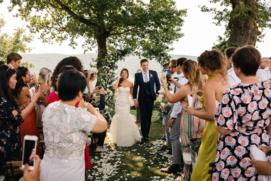 bride and groom are crying during the wedding ceremony