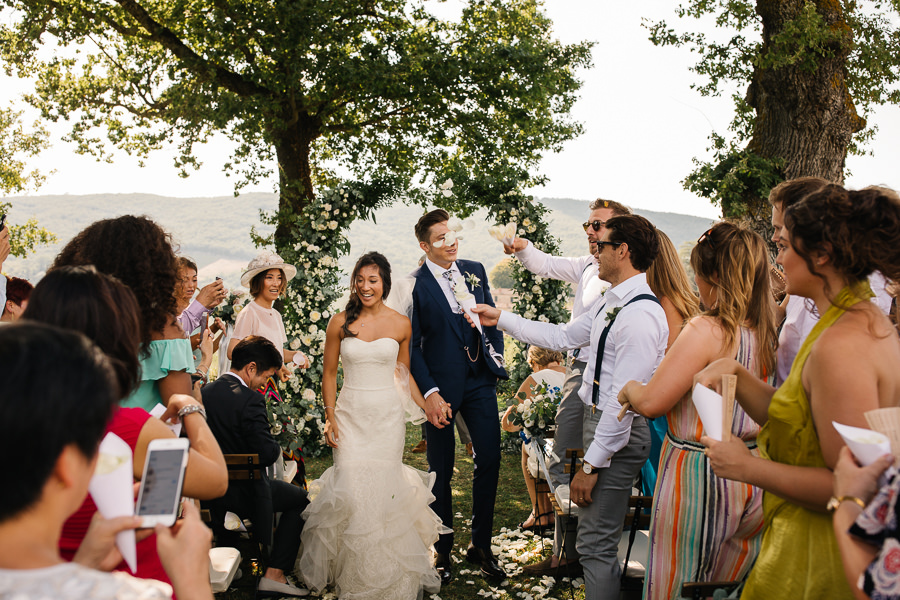 bride and groom are crying during the wedding ceremony