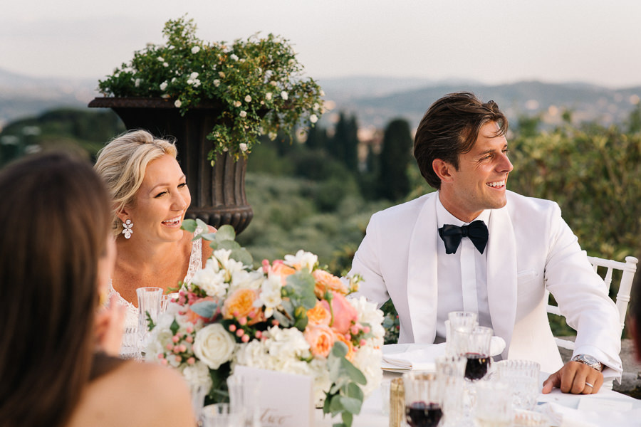 bride and groom walking down the aisle at villa di maiano