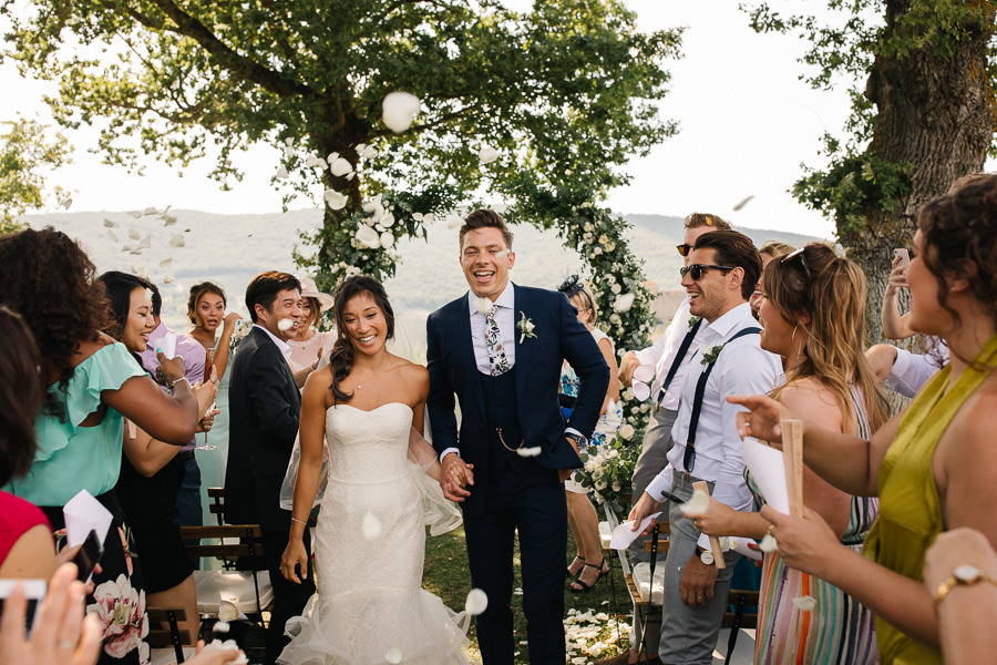 bride and groom are crying during the wedding ceremony