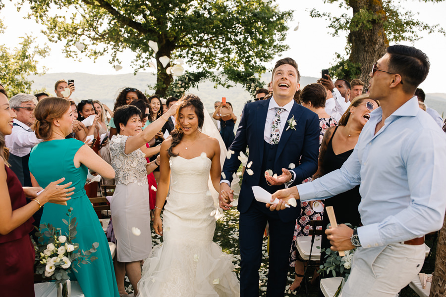 bride and groom are crying during the wedding ceremony